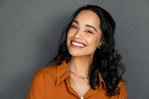 Woman smiling after appointment at Martin Periodontics in Mason, OH